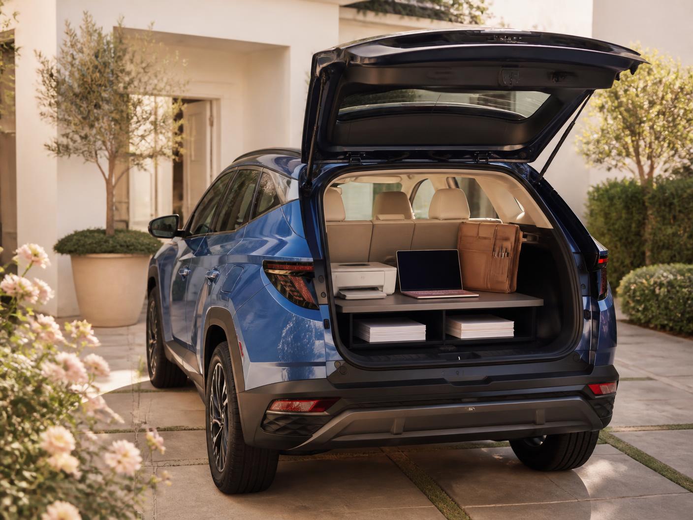 Illustrative photograph of a blue compact SUV with a prepared mobile office setup in the cargo area